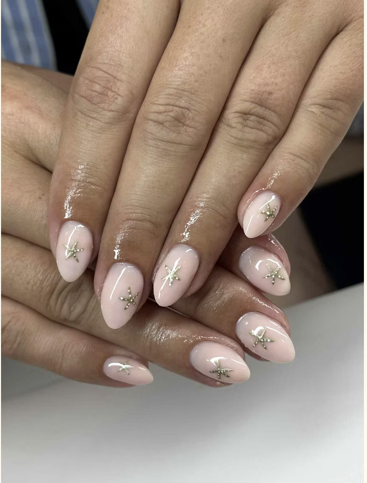 Milky almond nails with silver star charms