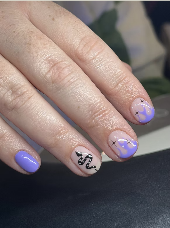 Lilac nails with swirl and snake nail art
