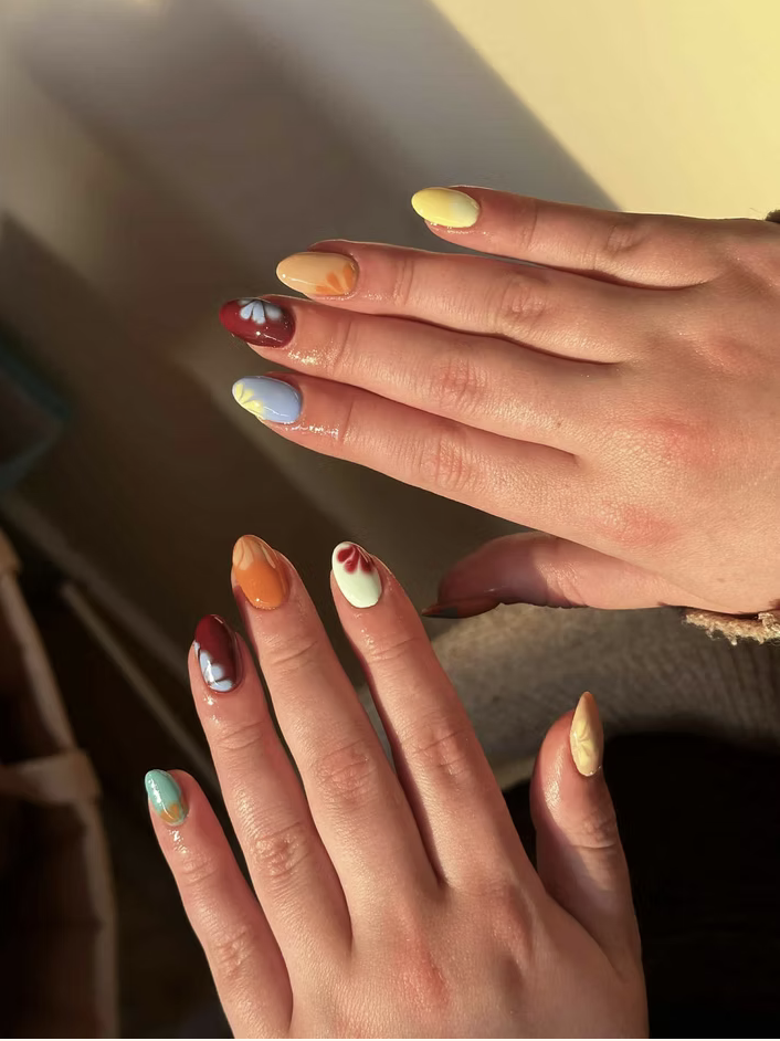 Multi-coloured almond nails with hand-painted florals