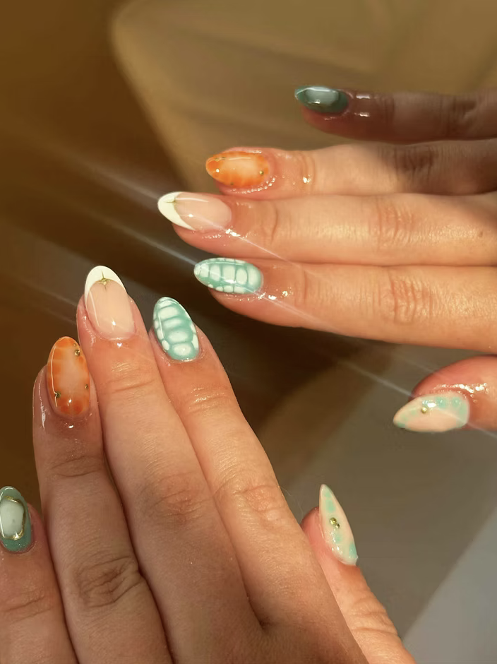 Sage and peach nail art with gold detailing
