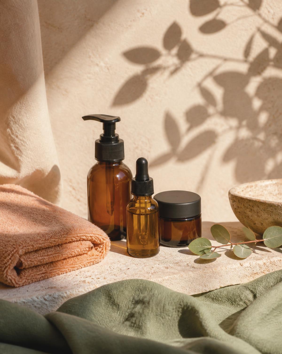 Organic facial oils and skincare on a stone ledge